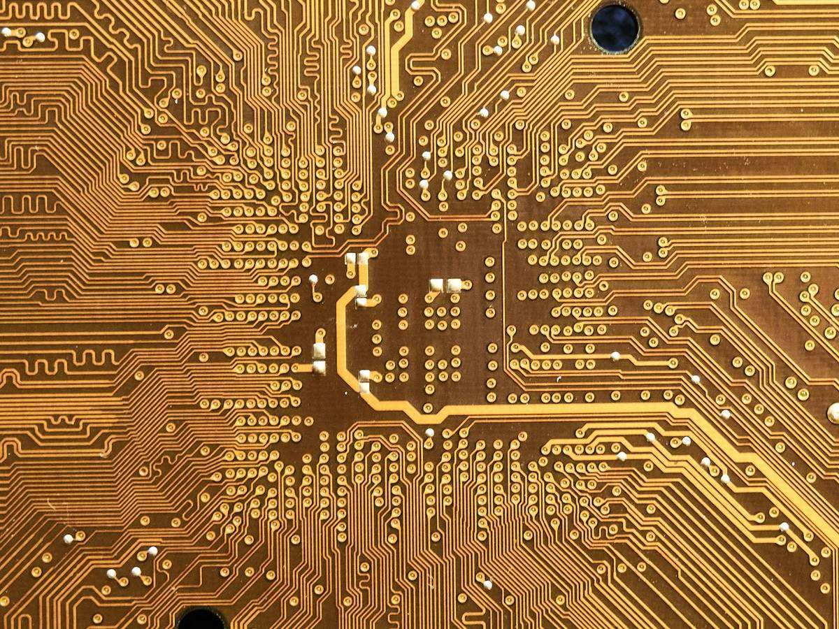 Macro photograph of a gold printed circuit board
